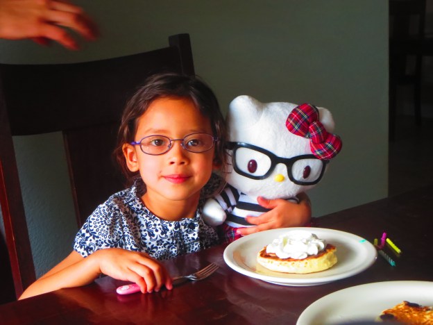 Miss Marley with ehr new Hello Kitty, both of them in glasses