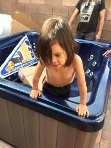 Jackson inside the empty hot tub