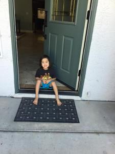 Jackson waiting at the front door for his big sister to come home from school