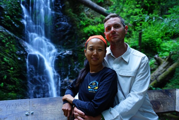 hubby and I with a waterfall behind us, This photo was taken on our 14 mile hike day in Big Basin State Park.